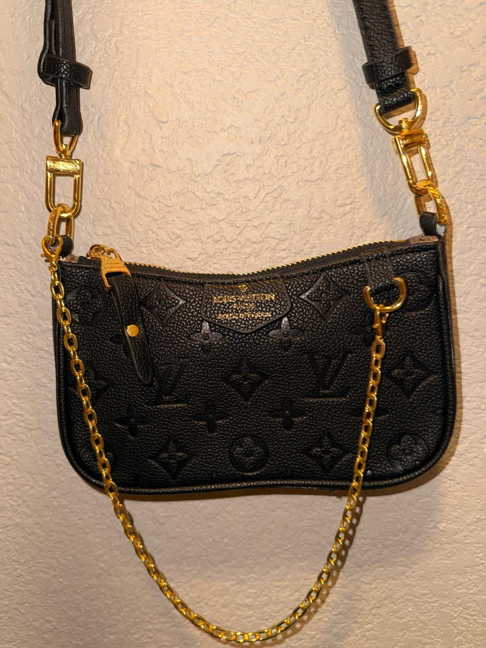 Louis Vuitton Black Embossed Monogram Mini Pochette with Gold Hardware